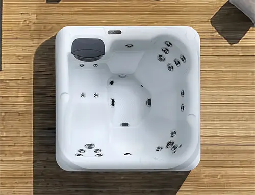 Overhead view of hot tub interior showing jets and control features for hydrotherapy spas